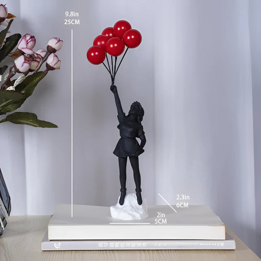 Black urban art-inspired resin statuette of a girl holding a balloon, featuring a modern design with a picture frame in the background.