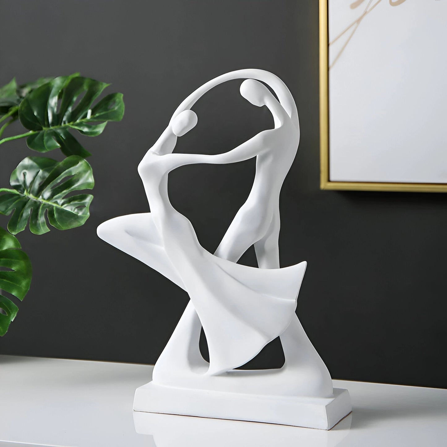 Abstract white resin sculpture depicting a modern dance couple in a graceful gesture, measuring 30cm x 20cm, designed for art decor.