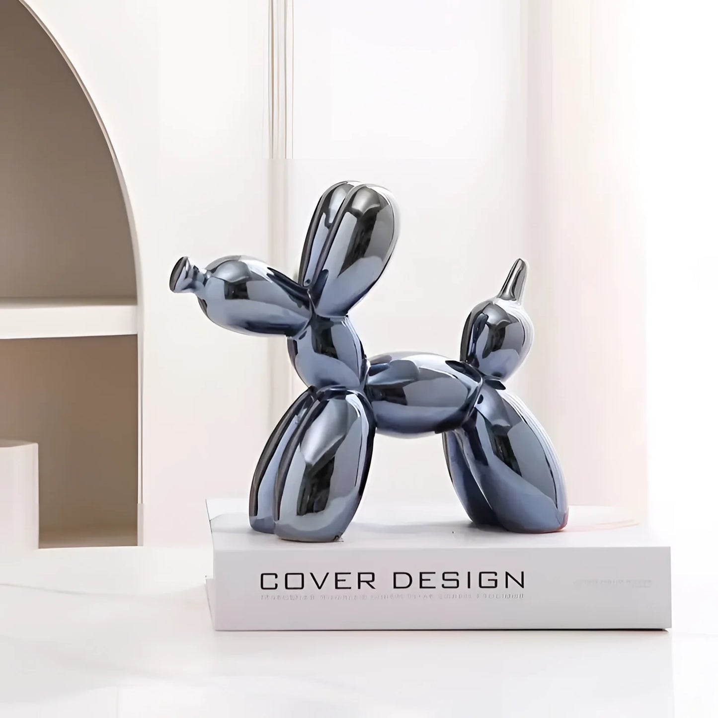 Silver balloon dog sculpture with a metallic finish in navy blue, designed as contemporary art decor.