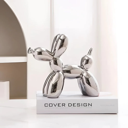 Silver Balloon Dog Sculpture in a metallic finish, resembling contemporary art decor with a smooth, reflective surface.